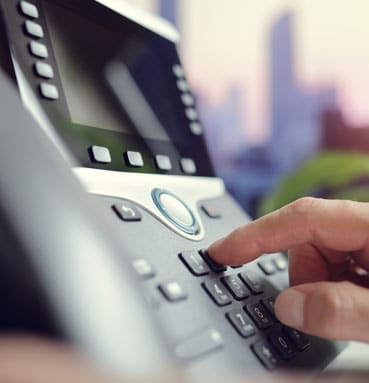 Business desk phone being used
